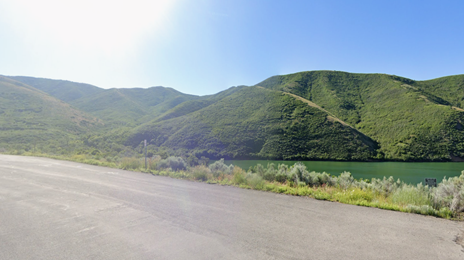 A road with green hills and blue sky

AI-generated content may be incorrect.